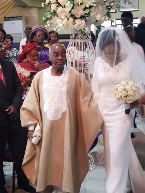 Bishop Oyedepo walking Joyce down the aisle